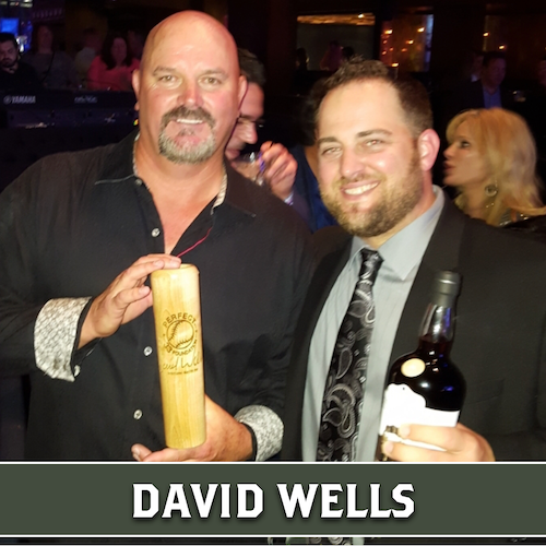 David Wells holding a wooden Dugout Mugs baseball bat mug