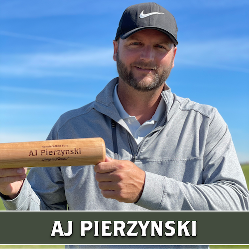 AJ Pierzynski holding a personalized wooden Dugout Mugs baseball bat mug horizontally outdoors.